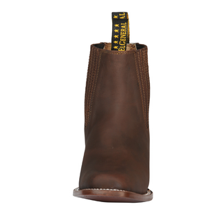 Brown leather boot with a brand label