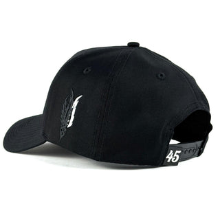 Adjustable snapback of black Forty Five hat with white 45 detail and black & white feather embroidery.