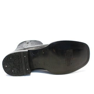 Close-up of outsole Artillero women’s black leather cowboy boot with embossed logo on black leather outsole