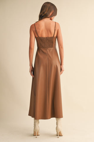 Back view of brown Faux Leather Corset Midi Dress showing smocked detail and A-line