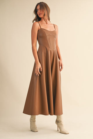 Full-length view of Brown Faux Leather Corset Midi Dress styled with heeled boots