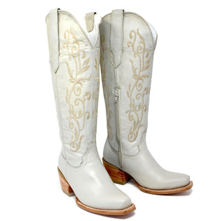 Pair of Artillero women’s pearl cowboy boots with 16 inch embroidered shaft, 2.5 inch heel, and snip toe design