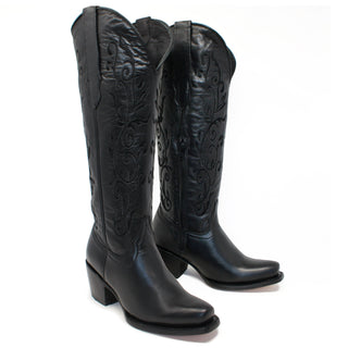 Pair of Artillero women’s black cowboy boots with 16 inch embroidered shaft, 2.5 inch heel, and snip toe design