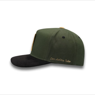 Olive green snapback with gold 'San Juditas Tadeo' embroidery on side panel.