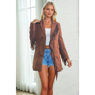 Woman wearing a camel faux suede western, styled in boho cowgirl fashion