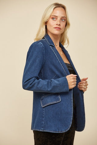 side view of a classic blue denim blazer styled in modern western chic fashion