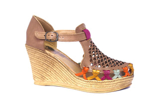 Side view closed toe wedge with leather net design cut out and bright multicolor leather woven face trimming