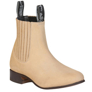 Beige ankle boot with brown heel on a white background