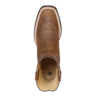 Brown cowboy boot with intricate stitching 