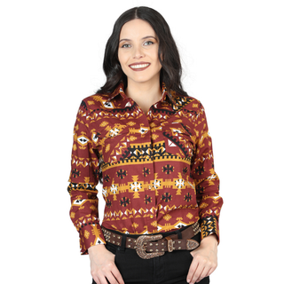 Woman wearing a Brick colored El General long-sleeve Western shirt with Aztec pattern.