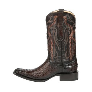 Brown cowboy boot with intricate patterns 