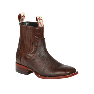 El Canelo brown leather western ankle boot with pull tabs and square toe design.