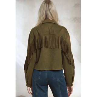 Back view of model wearing olive suede fringe western jacket with fringe tassels across the upper back area from arm to arm