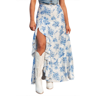 Woman wearing blue floral western high slit maxi skirt with white cowgirl boots