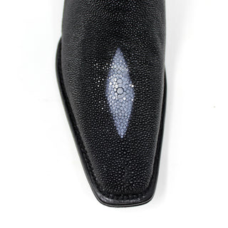 Front close-up of stingray single stone on toe of black boot