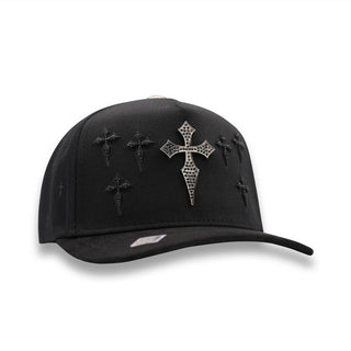 Angled front view showing embroidered cross pattern and silver emblem