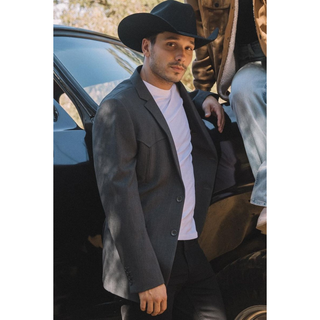 Model wearing Platini charcoal blazer with black cowboy hat – Western look