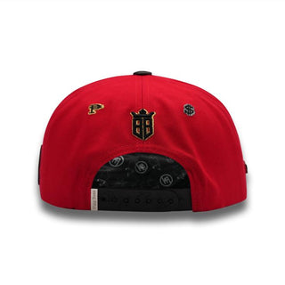 Back view of PERICO RED snapback with BIGG BOSS shield crown logo, peso and dollar signs