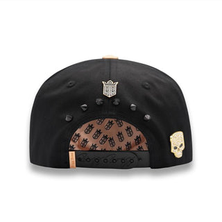 Back view with studs, skull detail, and snapback closure