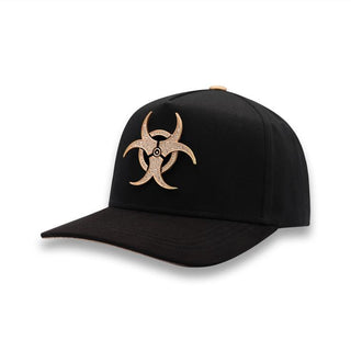 Front angle showing rose gold biohazard emblem on black snapback