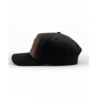 Side profile of King Ranch black structured snapback hat with curved brim