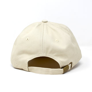 Rear view of adjustable khaki dad hat with metal clasp closure