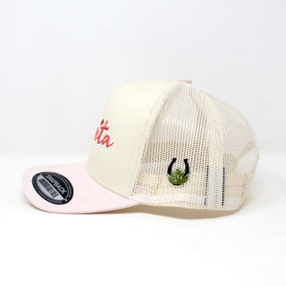 Side view of Fresita snapback cap with cream mesh back panel and pink brim, featuring embroidered red script on front and Mex West Logo (horseshoe and agave) on the side