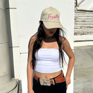 Woman wearing khaki Fresita hat with hair down