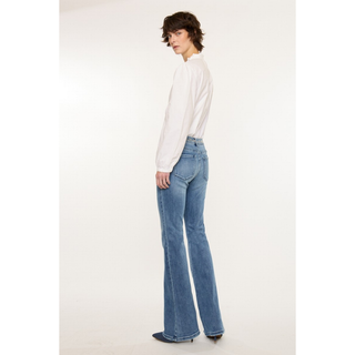 Back view light wash flare jeans with embroidered waistband
