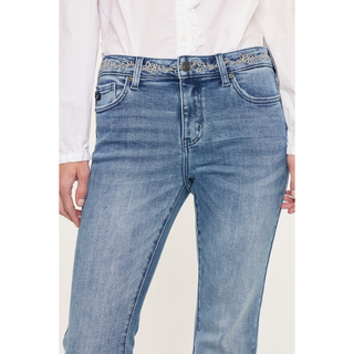 Close up embroidered waistband detail denim jeans