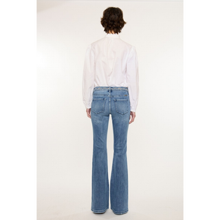 Back view light wash flare jeans with embroidered waistband