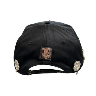 Back view of black JG LA clover snapback hat with adjustable snapback closure and metallic logo emblem
