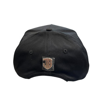 Back view of black JG Rancho snapback hat with metallic logo emblem