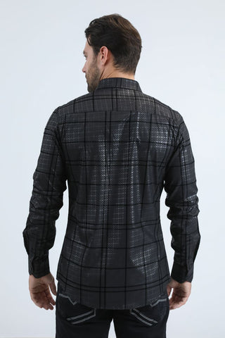Man wearing a black long sleeve geometric print button-down shirt paired with jeans, modern men's fashion look- back view 