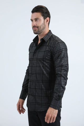 Man wearing a black long sleeve geometric print button-down shirt paired with jeans, modern men's fashion look- side profile