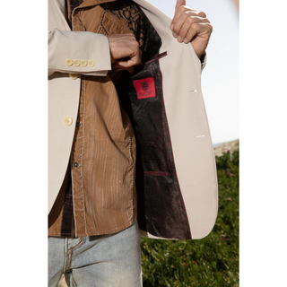 Men’s beige Platini modern fit stretch blazer showing black paisley lining and interior pocket detail.