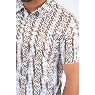 Close up of white polo with vertical brown aztec design