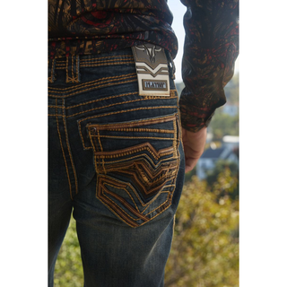 Back view of Platini Holt Dark Stone Slim Boot Cut Jeans highlighting embroidered pockets and western stitching.
