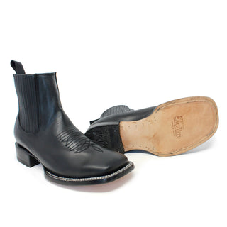 Pair Black leather boot with a visible brand name and sole on a white background