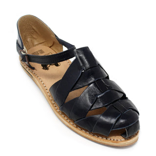 Women's handmade black genuine leather artisan huarache sandals featuring a woven leather upper, adjustable ankle buckle strap, cushioned leather footbed, and durable rubber outsole, handcrafted in Mexico for everyday comfort and style.