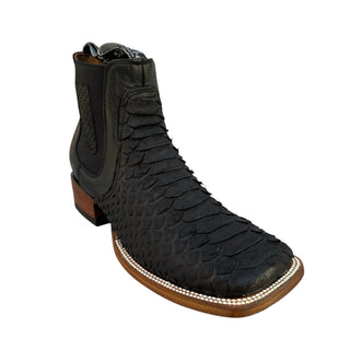 Angled front view of Ranchers black python snakeskin Chelsea boot featuring a wide square toe, pull straps, genuine exotic leather, and decorative welt stitching.
