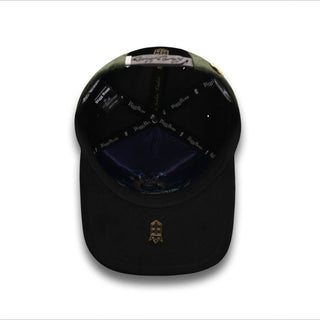 Interior of San Judas Green Snapback with custom Bigg Boss branding and gold stitched logo under brim.