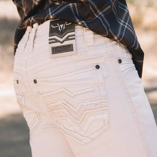 White pants with a brand logo on the back pocket, worn by a person in a plaid shirt.