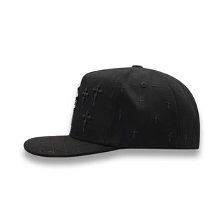 Side view of Cruz Black/Silver Snapback Hat with embroidered crosses