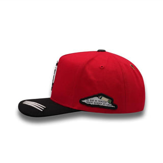 Side view of PERICO RED cap Embroidered Spanish saying “El que es perico, donde quiera es loco”