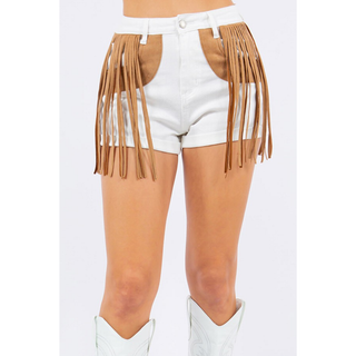 Close-up of white cowgirl fringe shorts with tan suede fringe detail