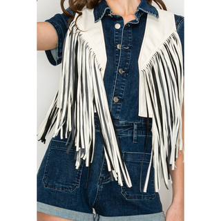 Close-up of white fringe vest showing layered fringe detail