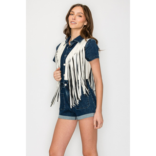 Side view of white western fringe vest layered with denim outfit