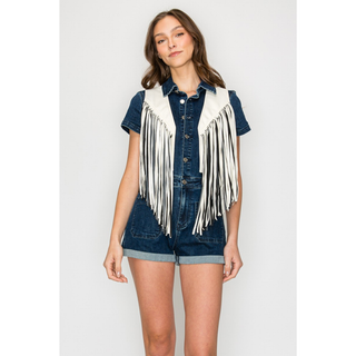 Women's white western fringe vest styled over denim romper