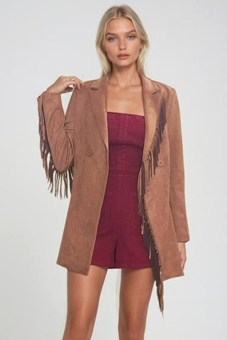 Woman wearing a camel faux suede western, styled in boho cowgirl fashion